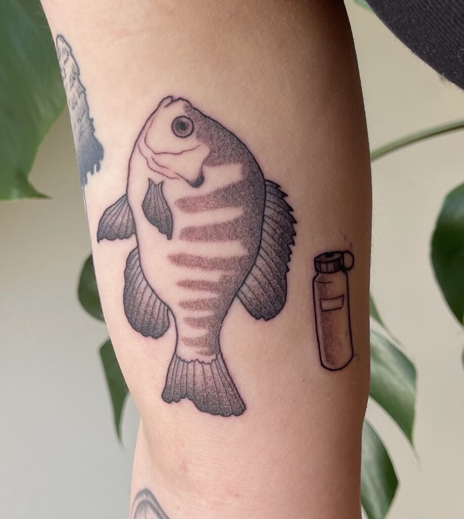 a tattoo of a bluegill fish with a nalgene water bottle next to it